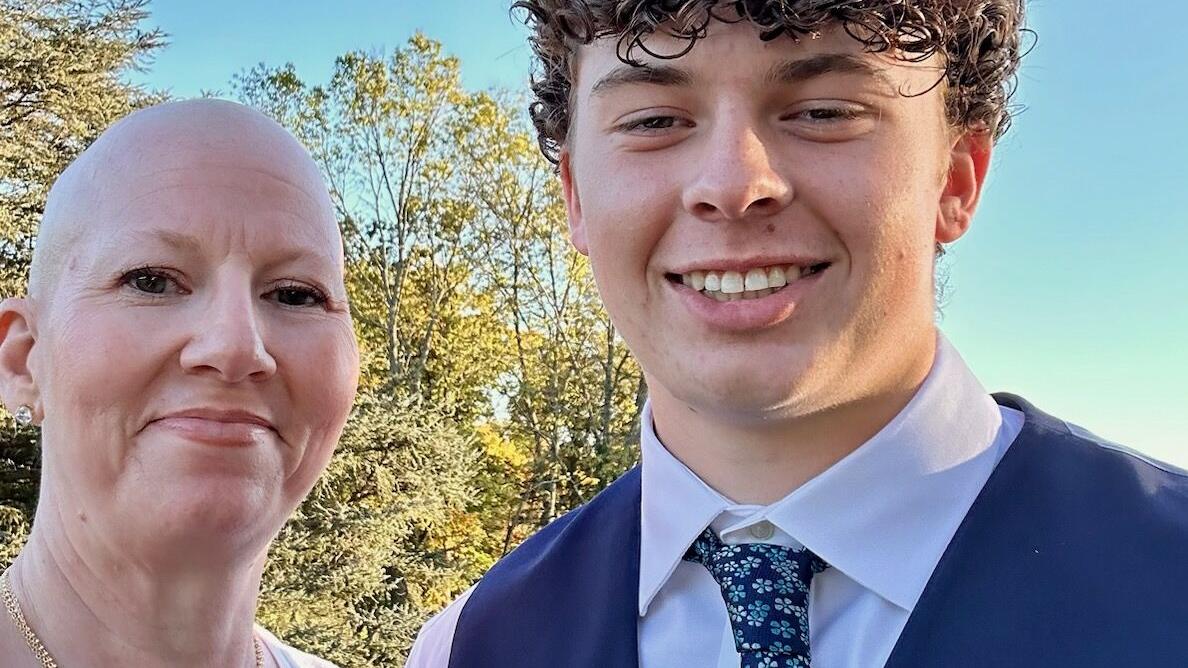 Hugs say it all for Patriot QB Tyler Knutson and his mother